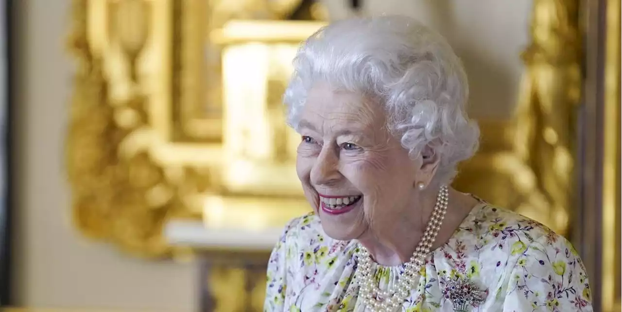 Queen Elizabeth Is Glowing in a Floral Dress While Admiring Fine China