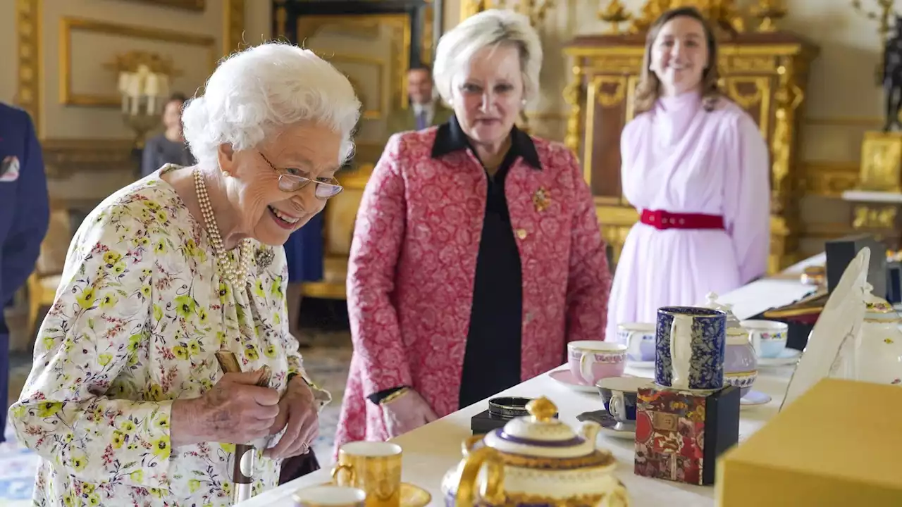 The Queen: Smiling monarch views hand-crafted artefacts at Windsor to mark Platinum Jubilee