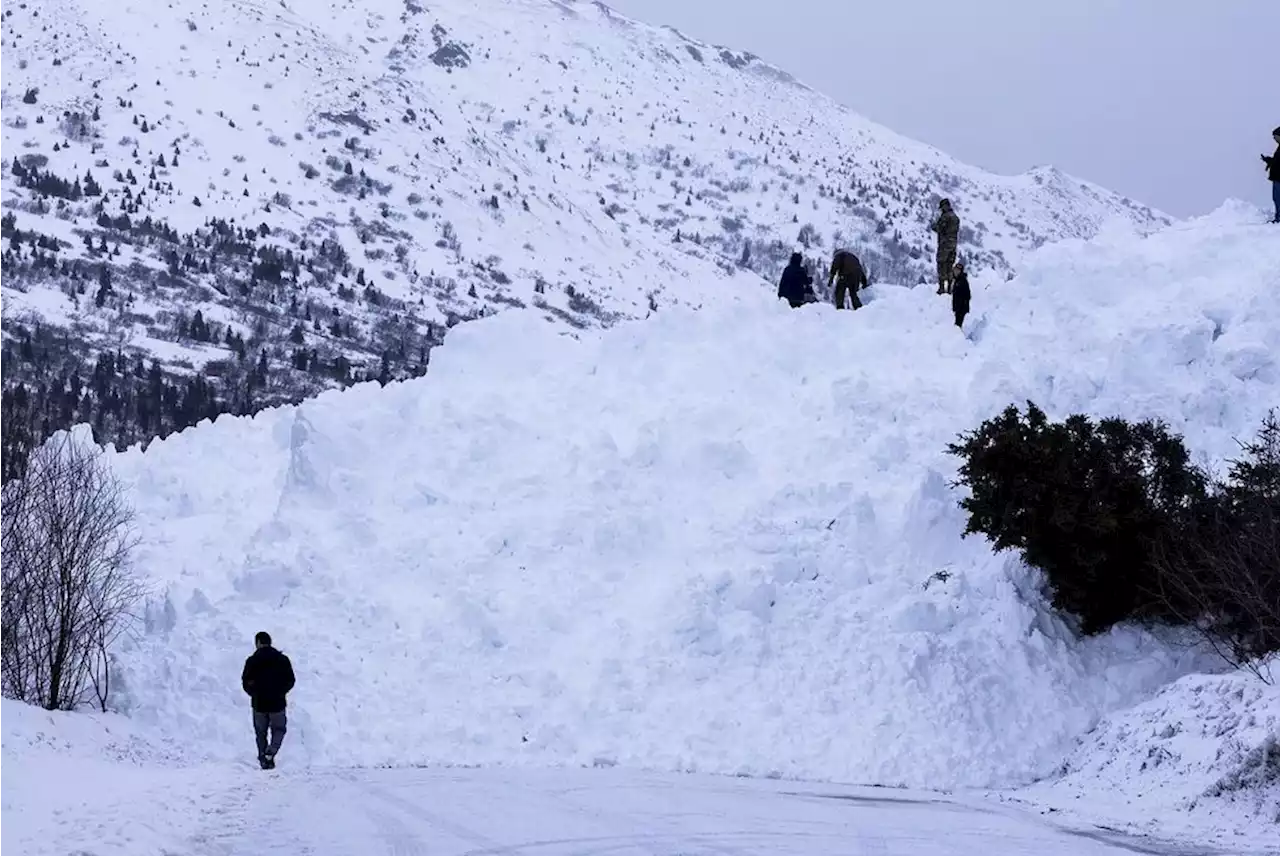 Avalanche blocking Hiland Road in Eagle River, trapping residents behind slide