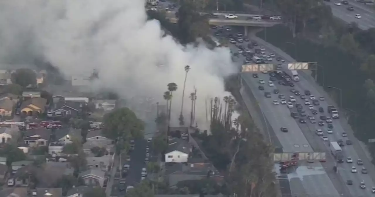 LAFD extinguish about 60 palm trees on fire off SR-60 in Boyle Heights