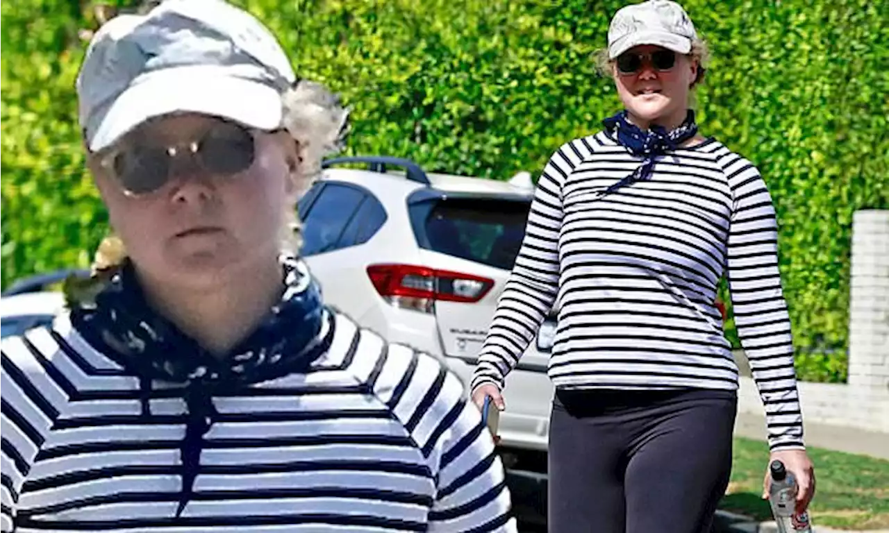 Amy Schumer steps out for a stroll after a grueling workout