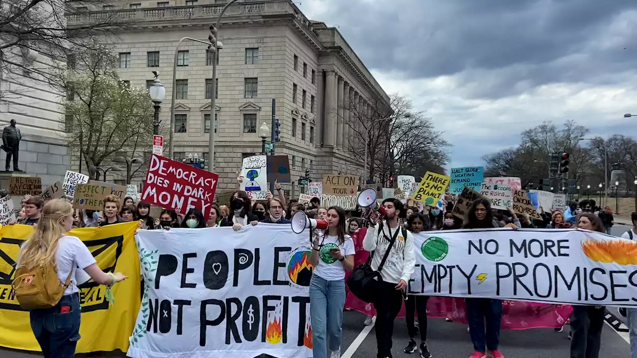 Activists march through DC demanding Biden declare a climate emergency