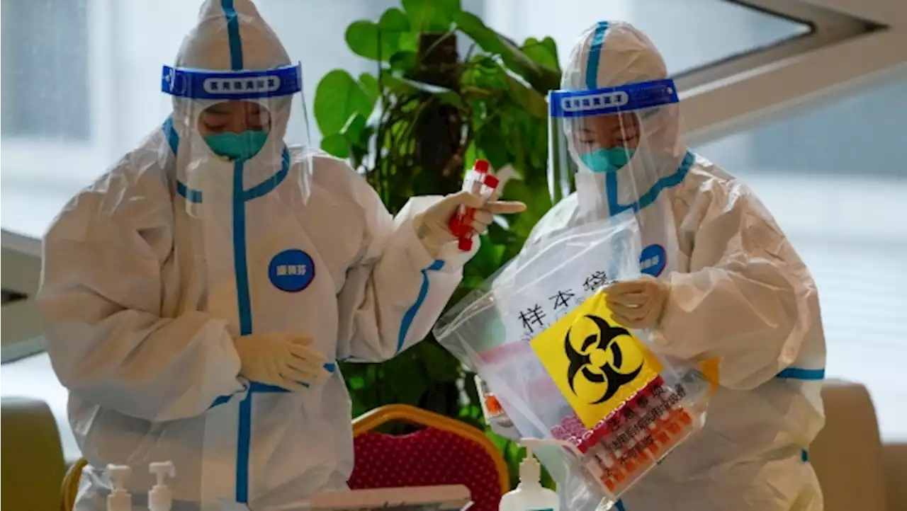 Shanghai to lock down in two stages for testing as COVID-19 cases spike
