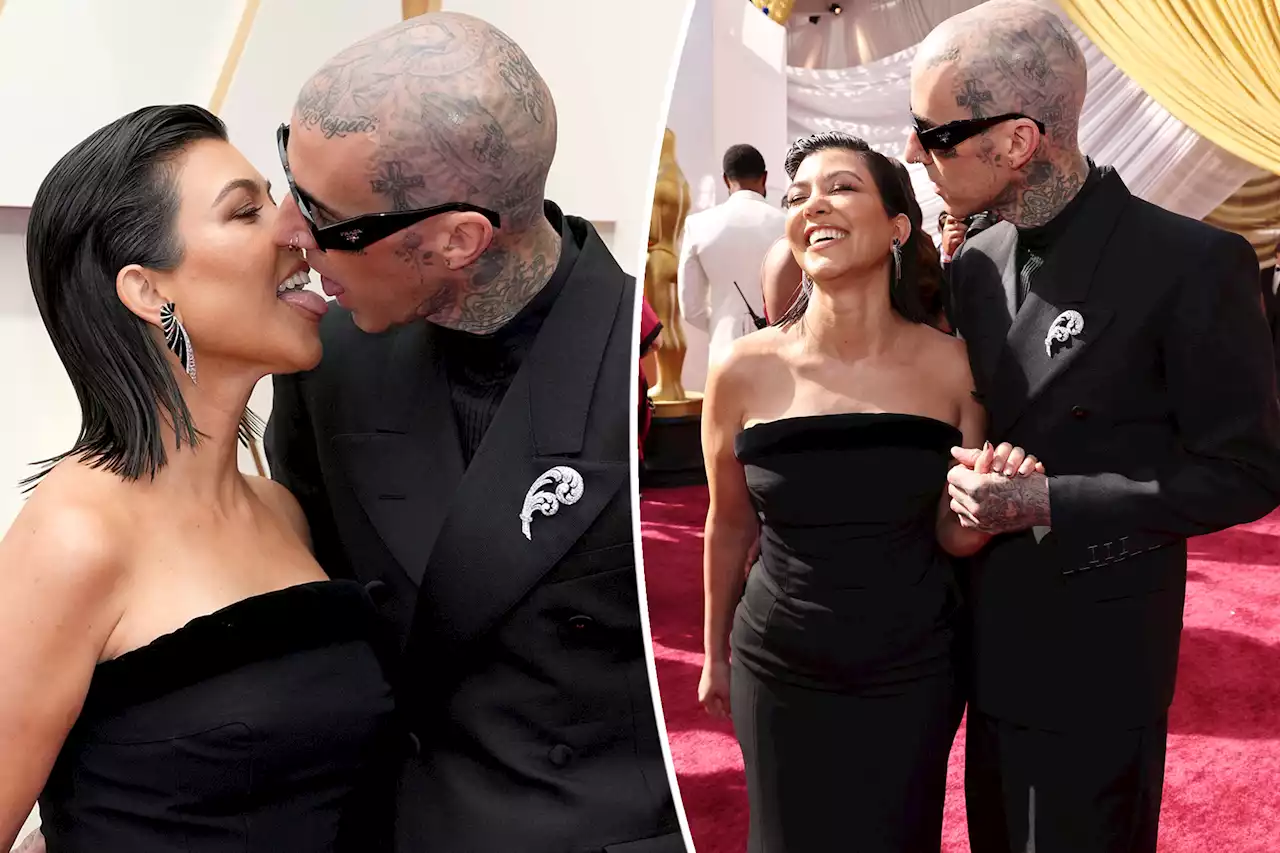 Kourtney Kardashian, Travis Barker touch tongues on Oscars 2022 red carpet