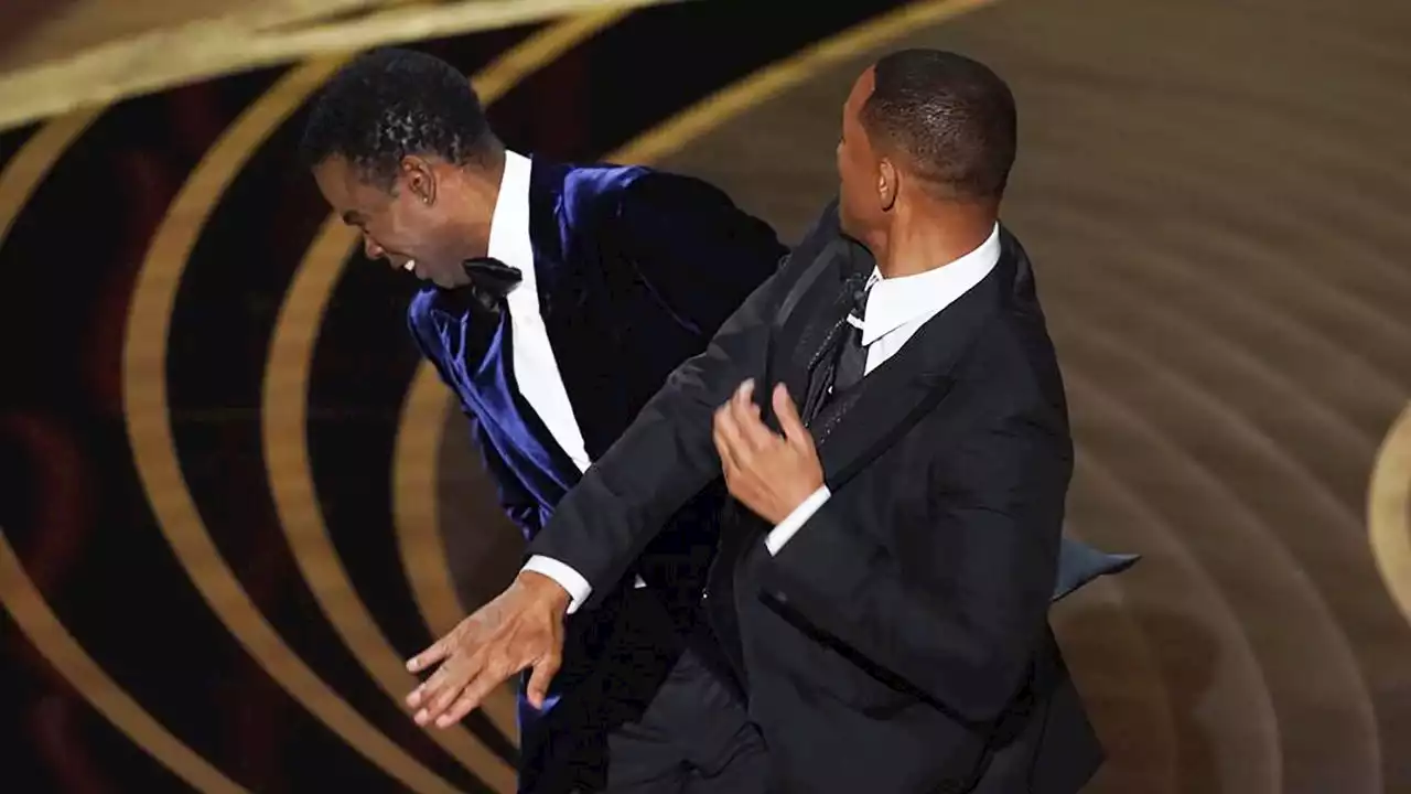 Will Smith confronts Chris Rock, then wins best actor Oscar