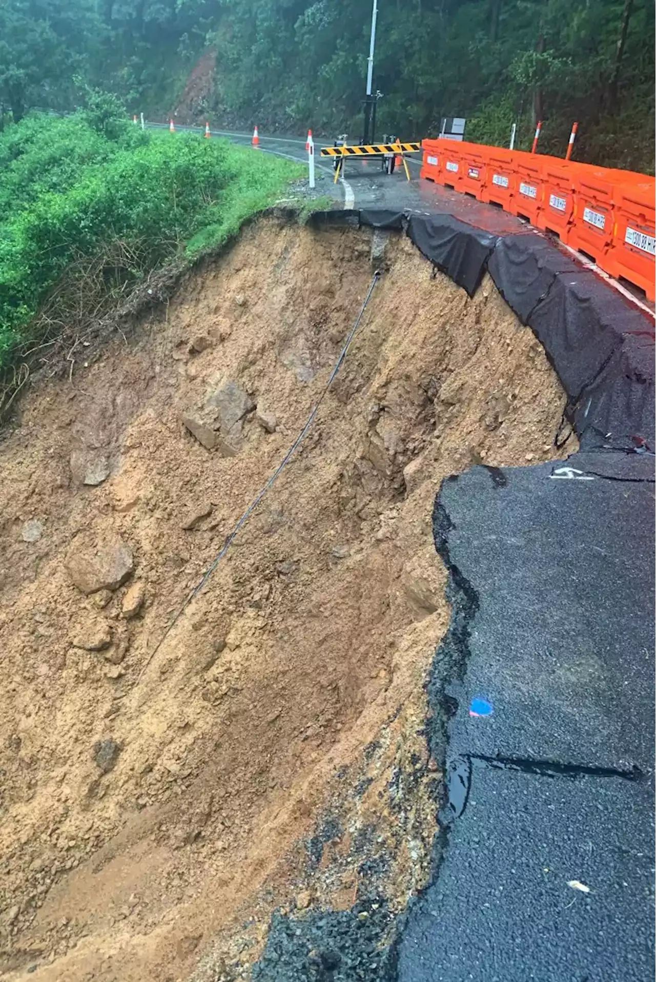 Man swept away in flood found dead, landslides close roads