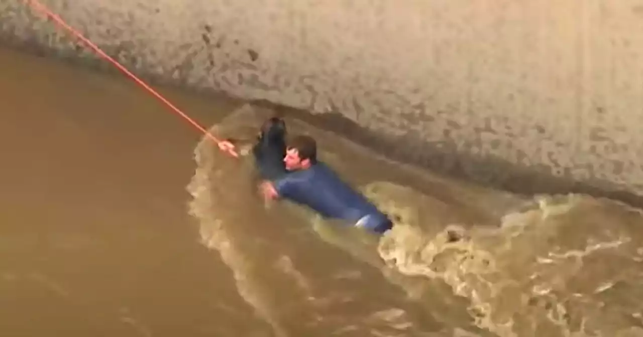 Firefighters rescue woman, man and dog from rain-swollen L.A. River