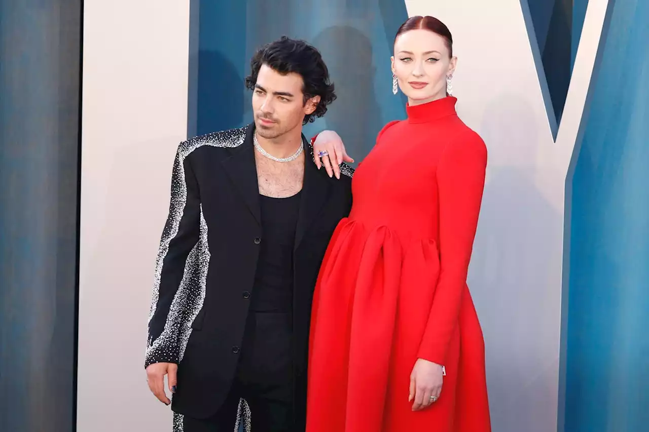 Sophie Turner Shows Off Her Pregnancy With A Stunning Red Gown