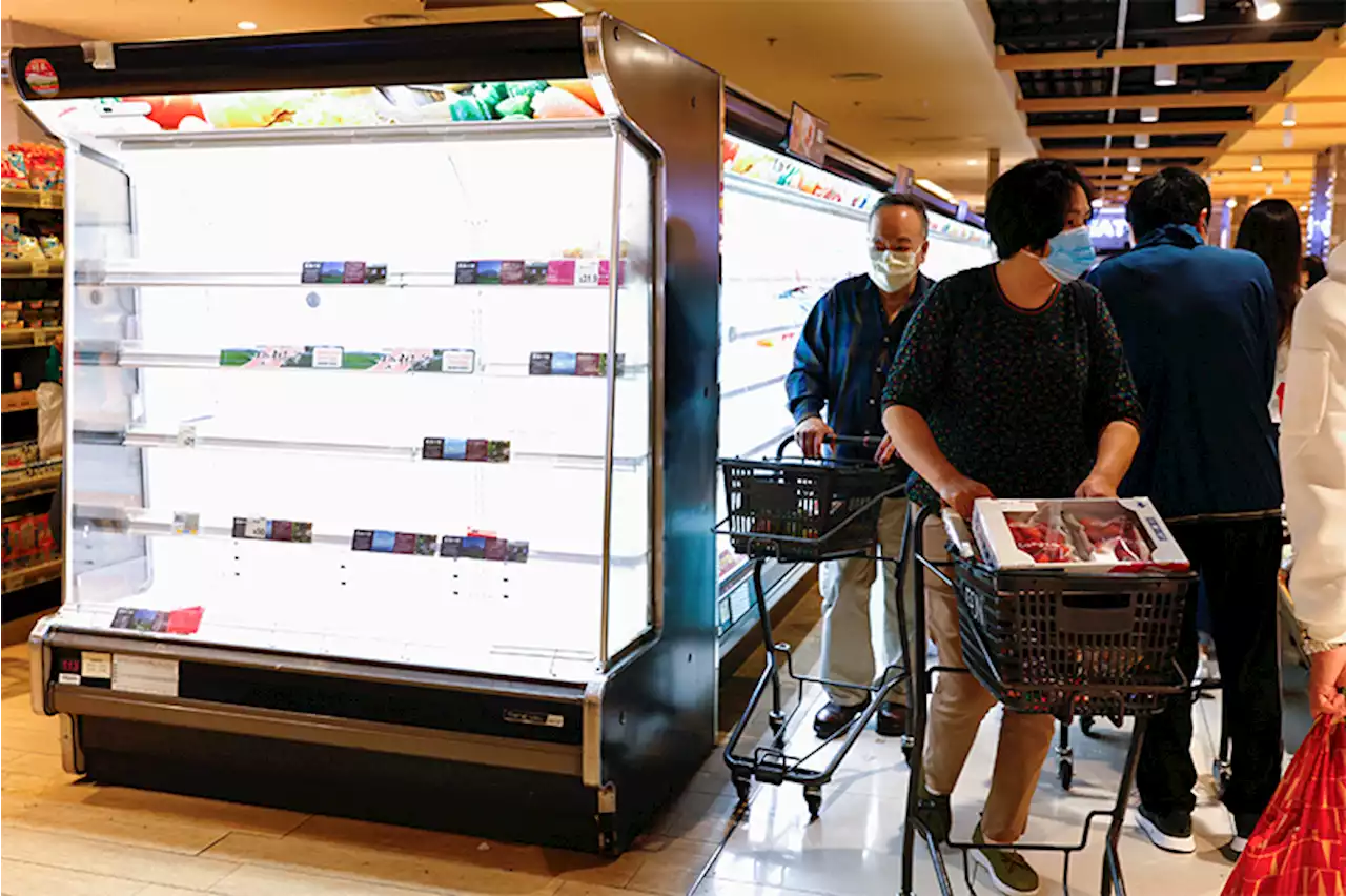Hong Kong transport operators, supermarkets cut services as COVID cases surge