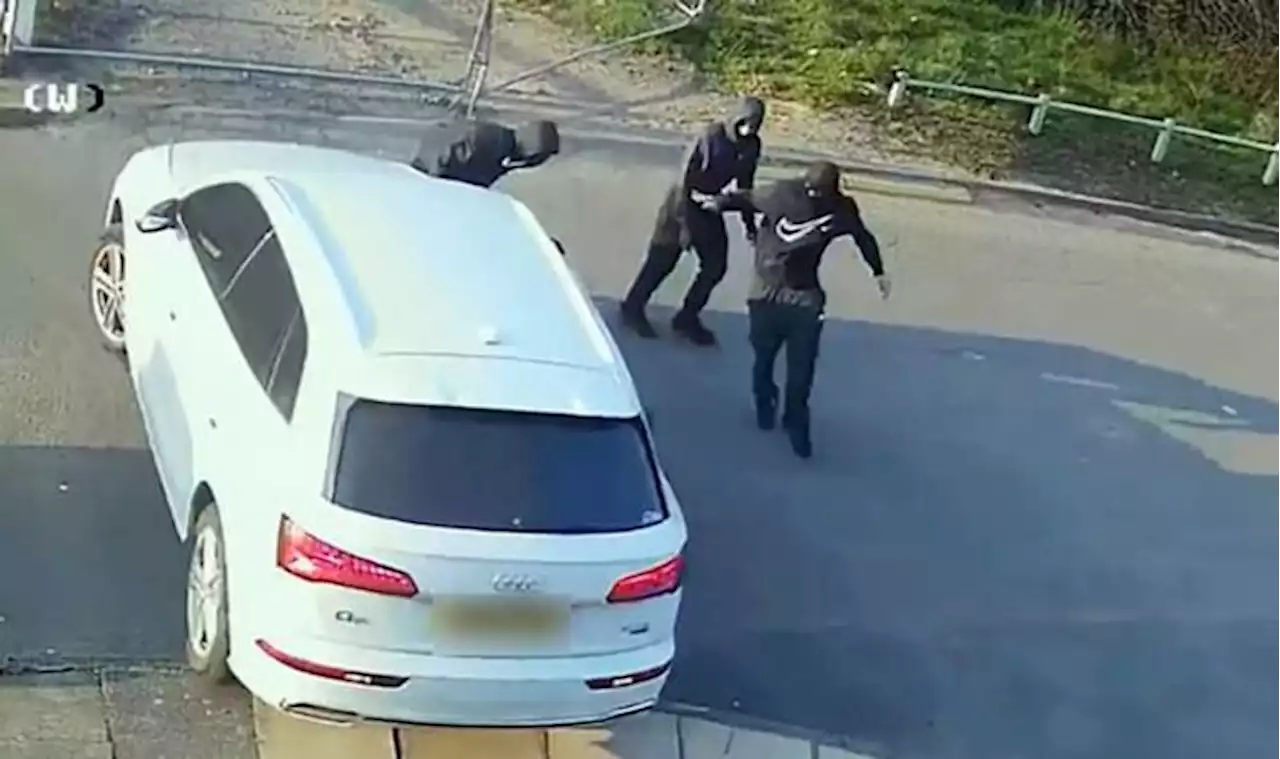 Terrifying moment carjack thugs smash Audi as boy, 7, screams inside