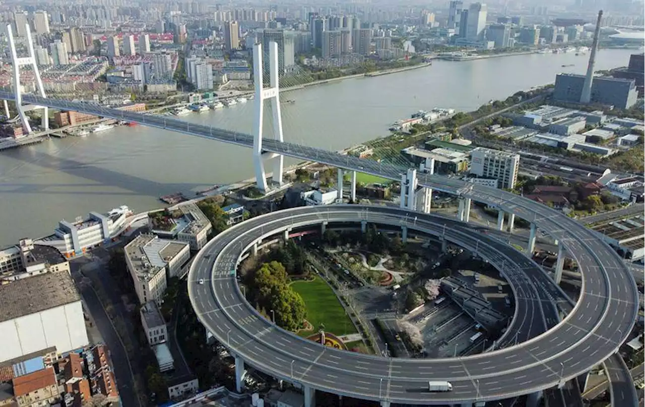 Shanghai expands COVID lockdown as new daily cases surge by a third