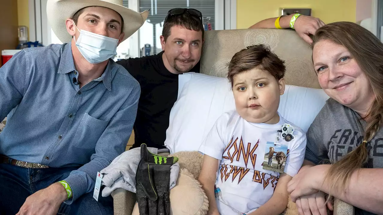 Boy awaiting heart transplant at Houston hospital meets world champion bull rider