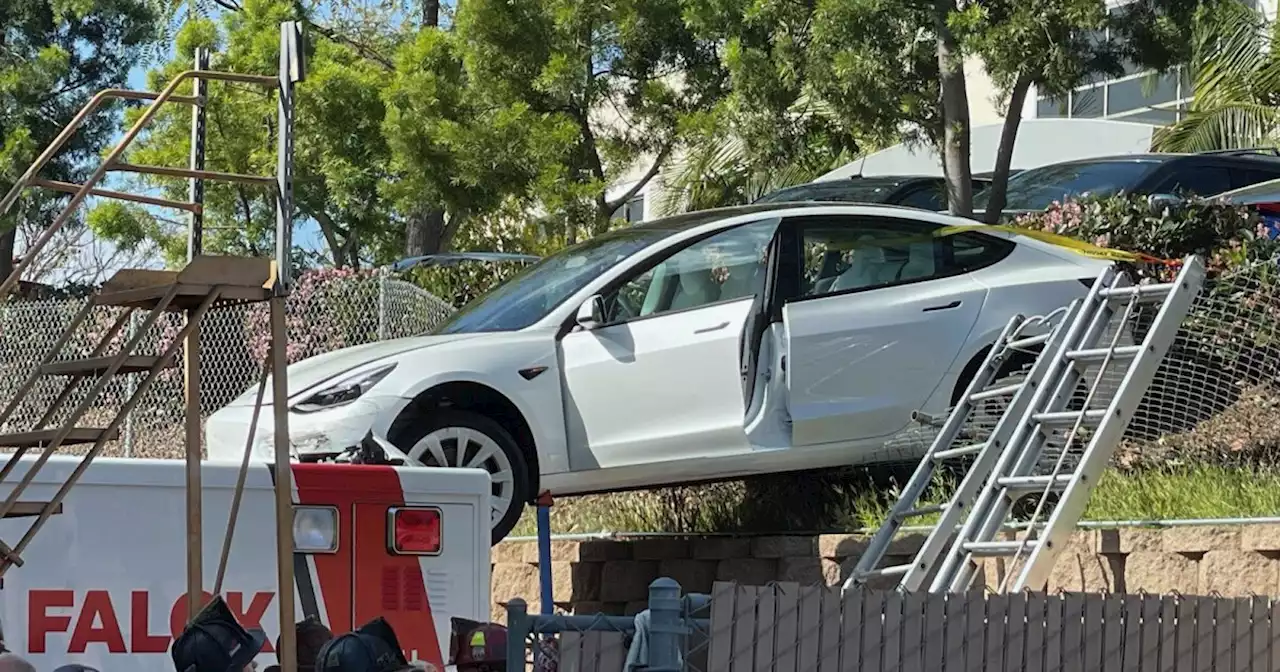 Kearny Mesa traffic crash leaves car atop parked ambulance