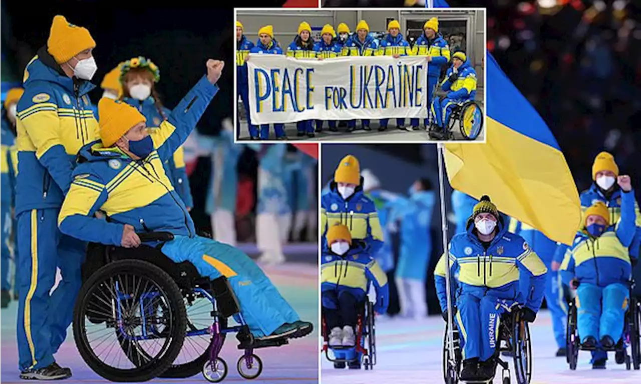 Ukraine's Paralympic team hold up fists in emotional opening ceremony