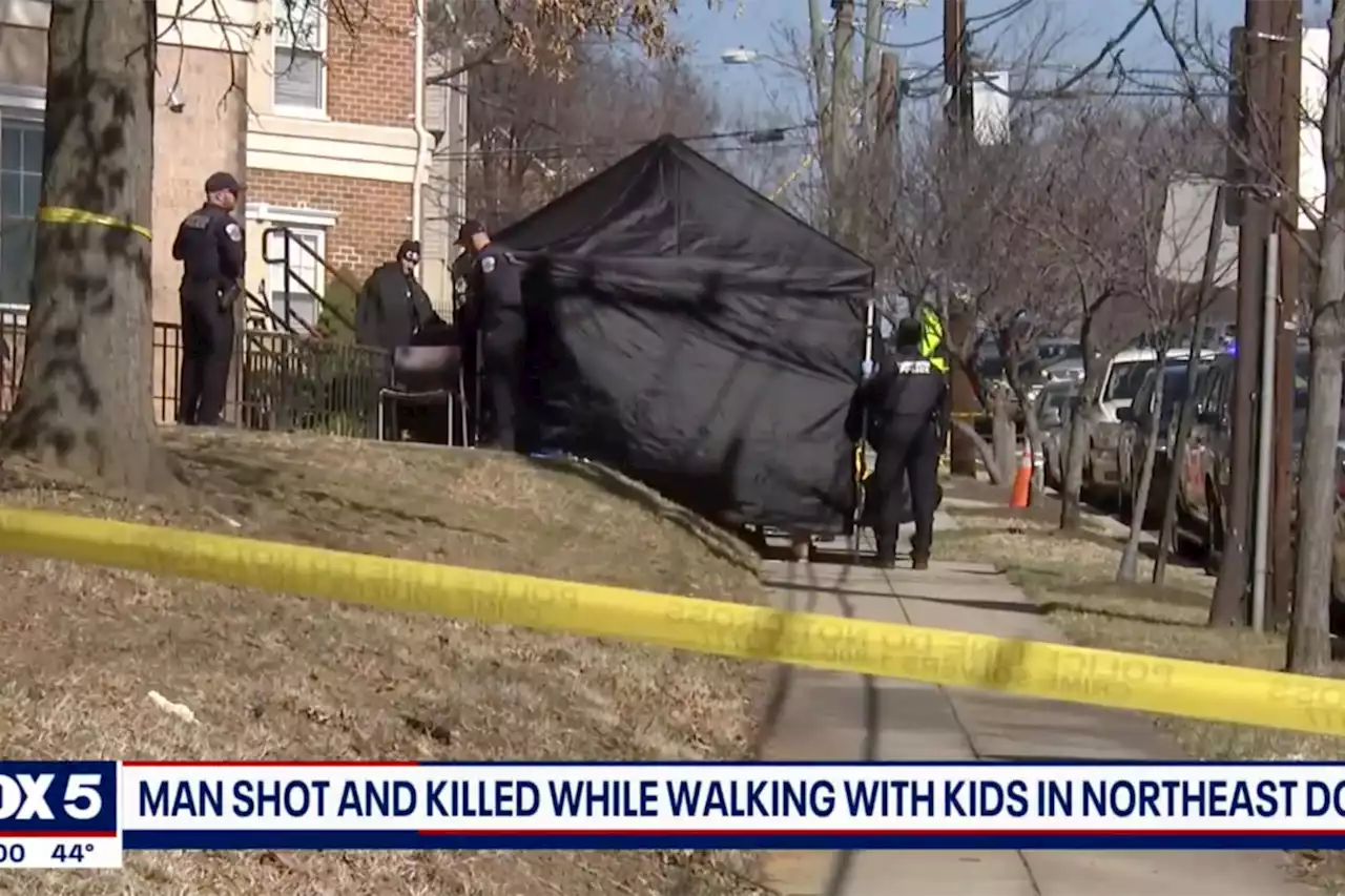 DC man fatally shot in street while carrying baby, holding hand of another child