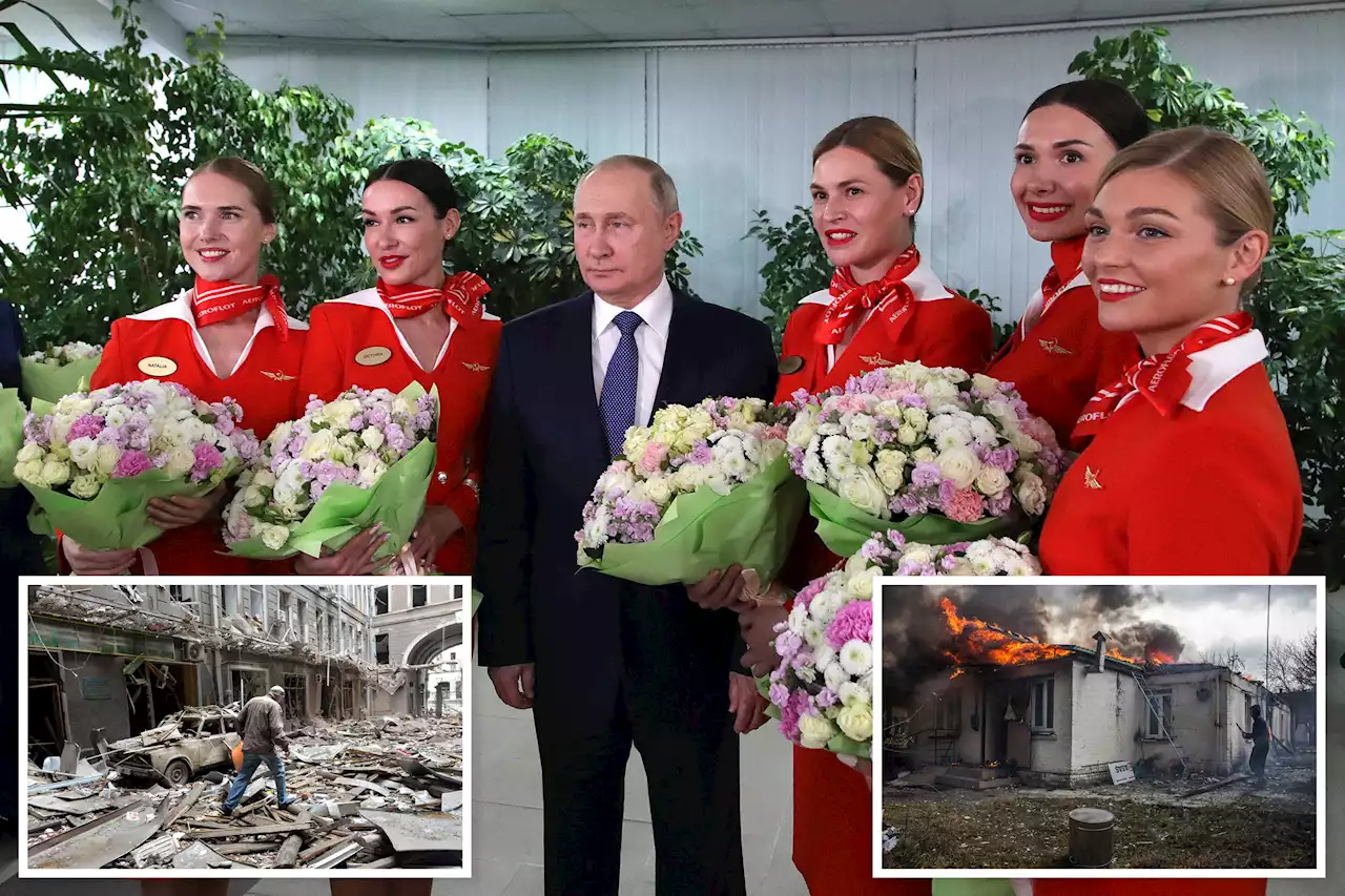 Putin, surrounded by female flight attendants and pilots, warns against NATO-backed no-fly zone