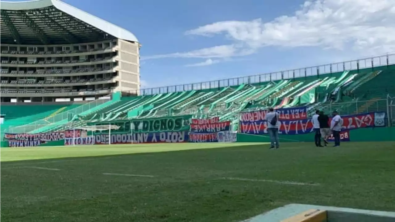 Escándalo: Barrabrava del Cali entró al estadio y colgó trapos robados al DIM