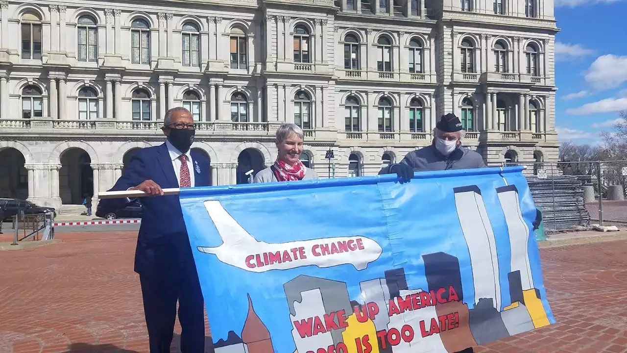 NY senators pose with 9/11-themed banner at climate change rally