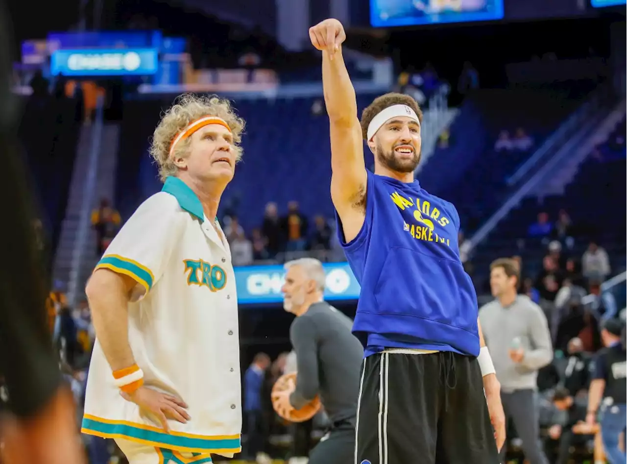 In “Semi-Pro” costume, actor Will Ferrell warms up with Klay Thompson, Steph Curry