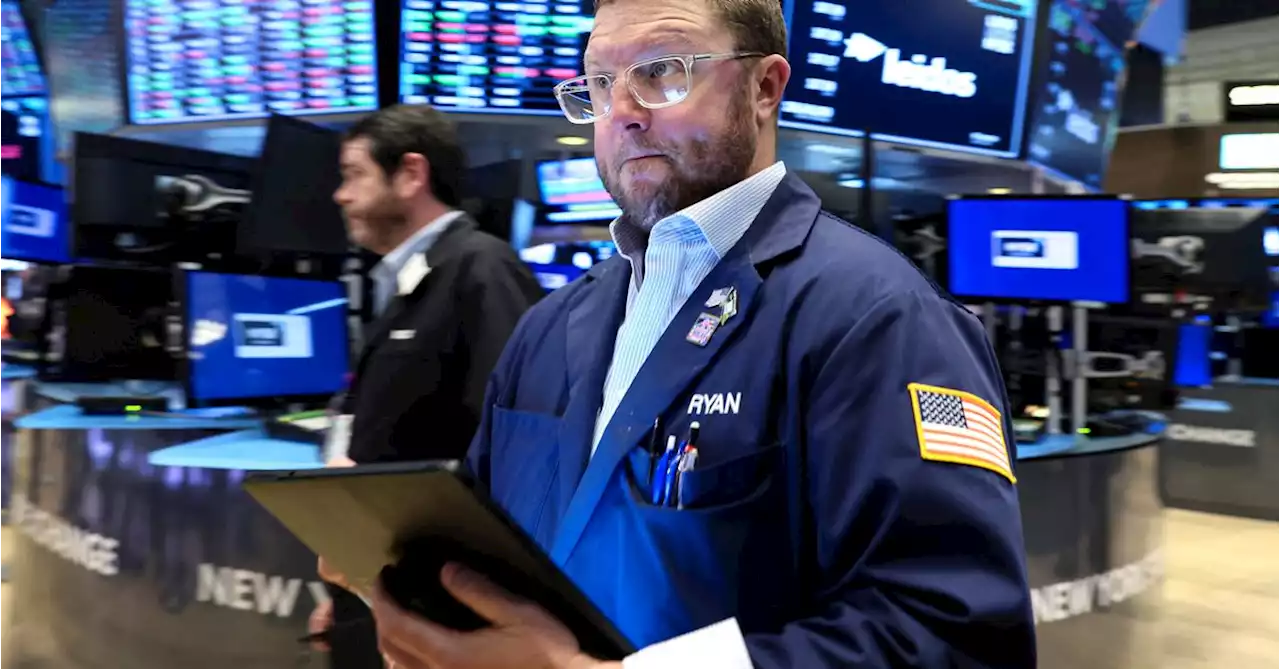 Wall St slips as jobs data backs hawkish Fed