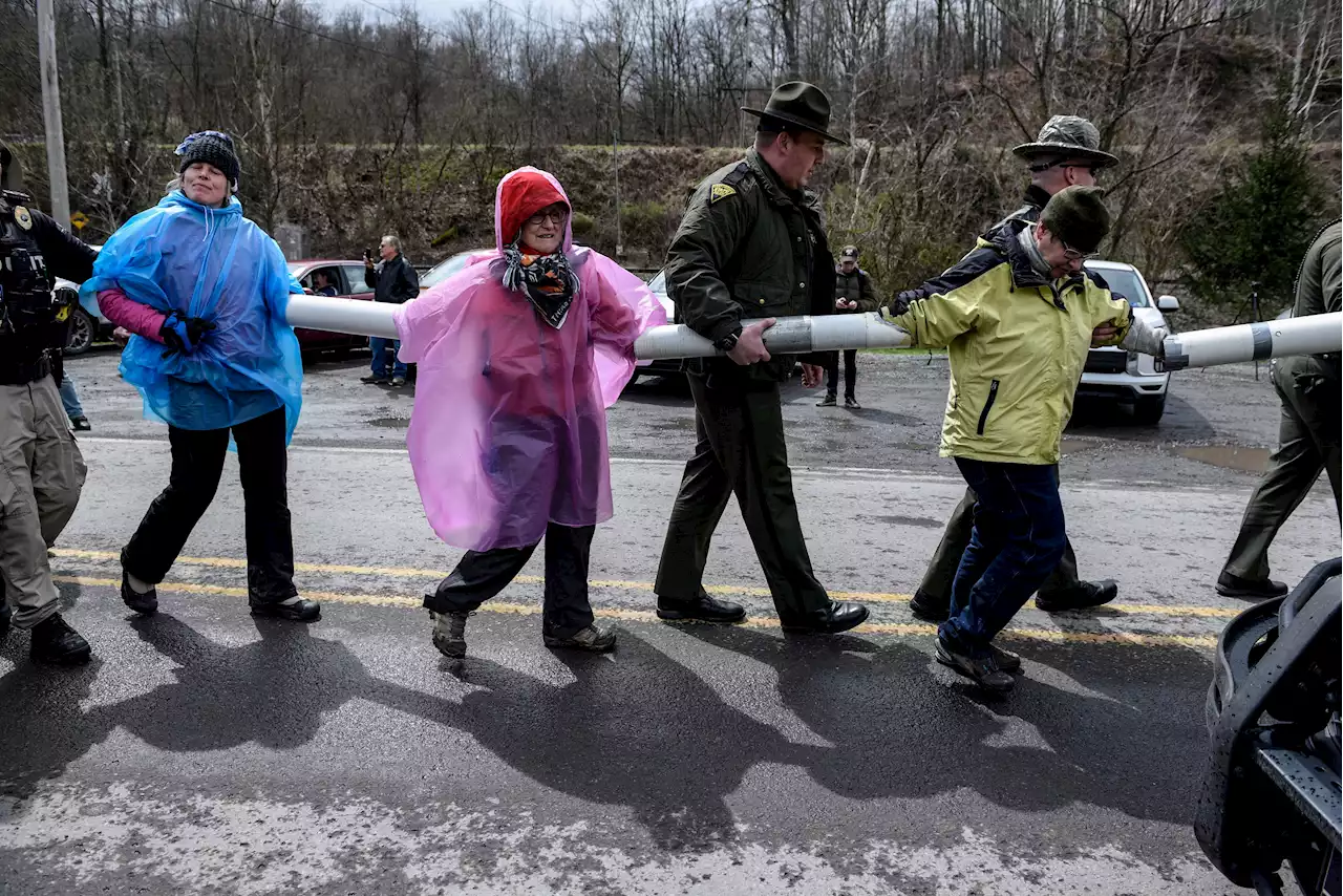 Protesters arrested at West Virginia coal plant with ties to Manchin