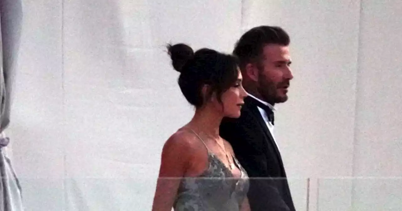 Victoria and David Beckham arrive hand in hand to watch their son tie the knot