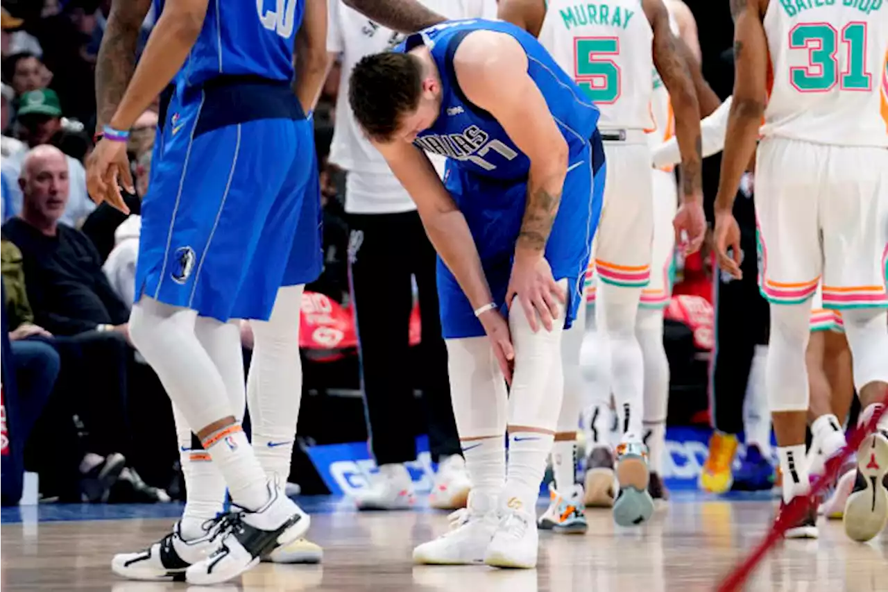 Doncic injury puts playoff status in doubt as Mavs top Spurs