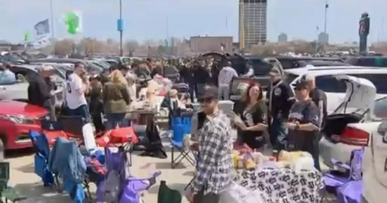 Baseball fans tailgate and smile in the sun at White Sox home opener