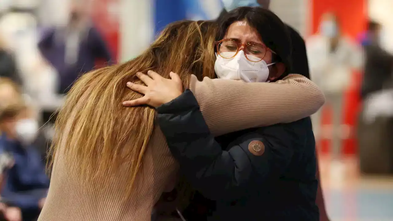 Emotional scenes as families reunite after New Zealand opens borders to Australian travellers