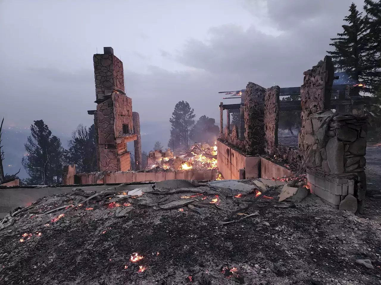 Wind whips destructive wildfires in New Mexico, Colorado