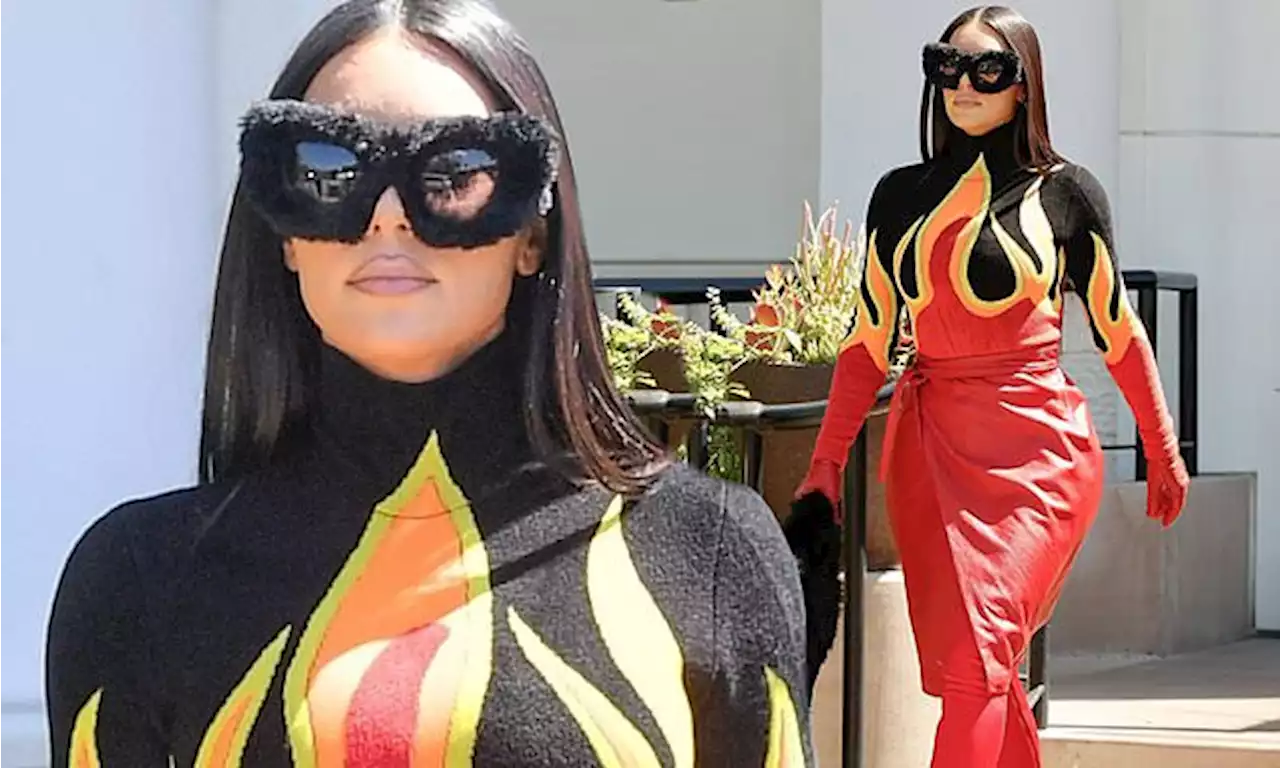 Kim Kardashian dons wacky flame-print catsuit for lunch with sisters