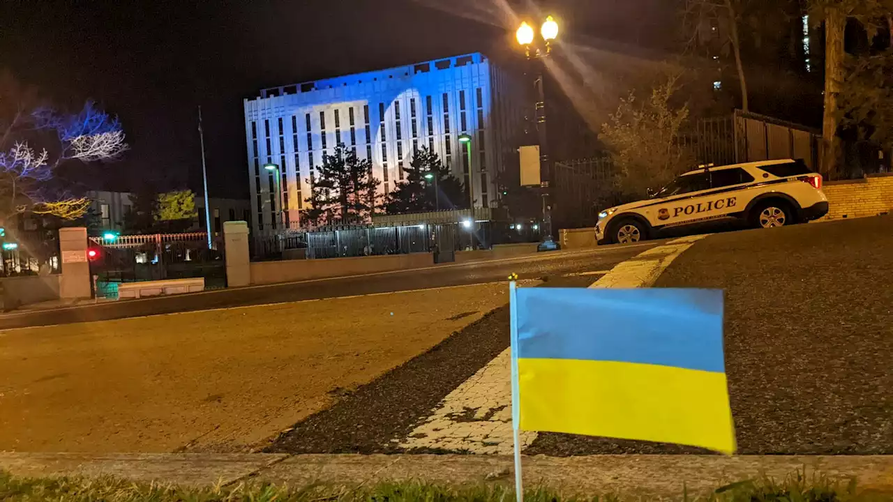 Activists train spotlight of Ukrainian flag on Russian Embassy