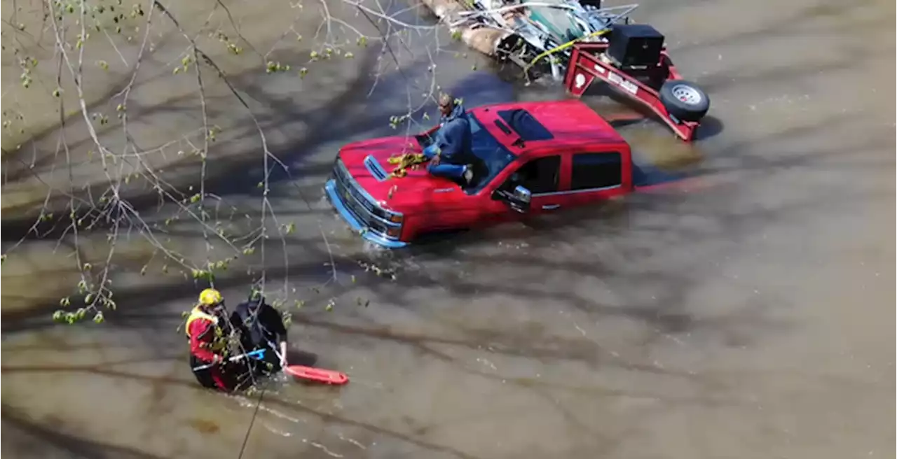 Two men rescued after truck is swept away by flood waters in Alabama