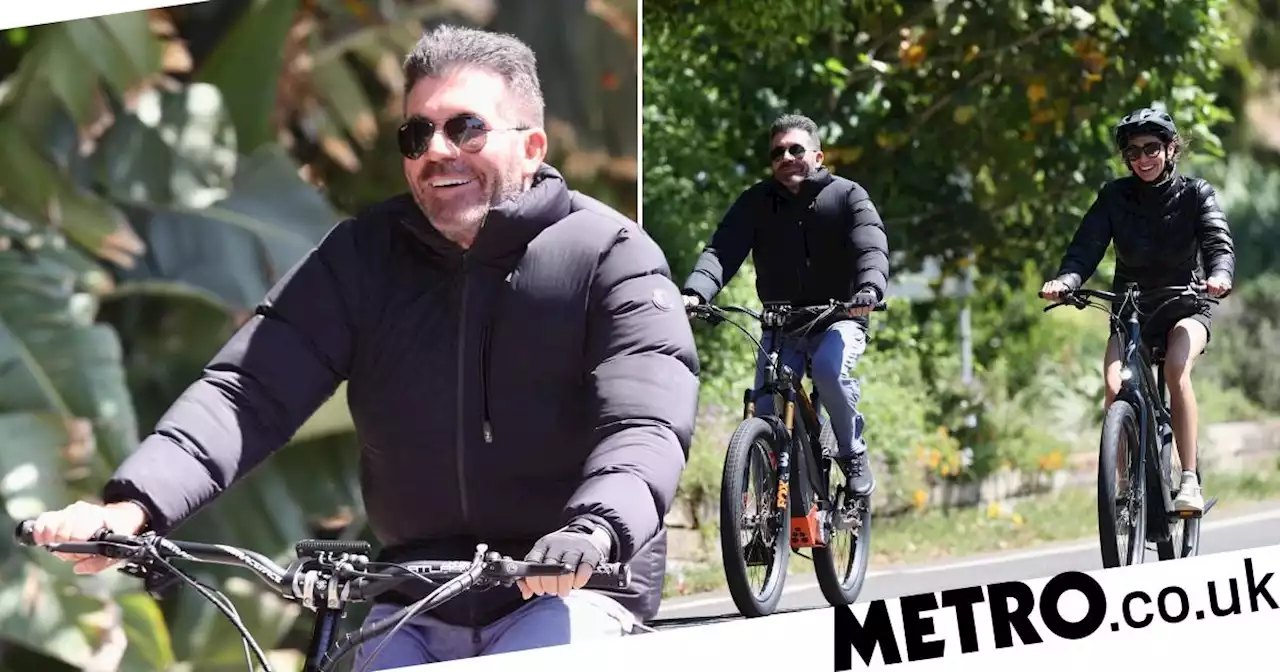 Simon Cowell all smiles on bike ride with fiancée after removing facial fillers