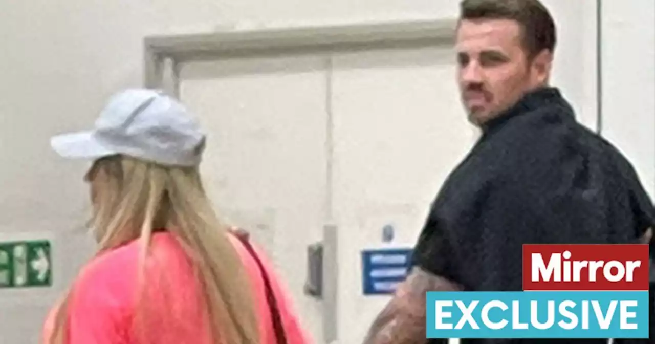 Katie Price and Carl spotted holding hands at airport - sparking reunion rumours