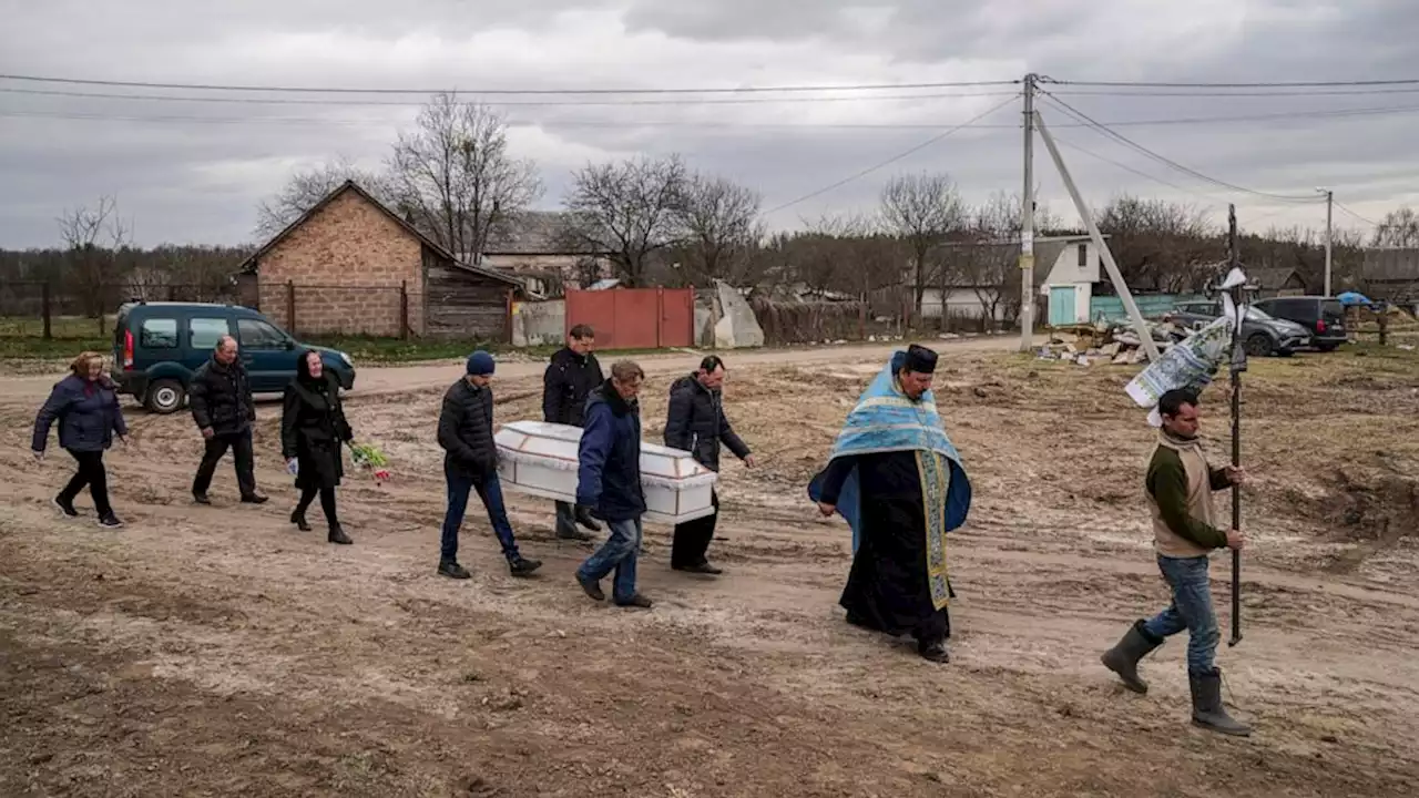 Ukrainian mom's pain at watching daughter's burial on phone