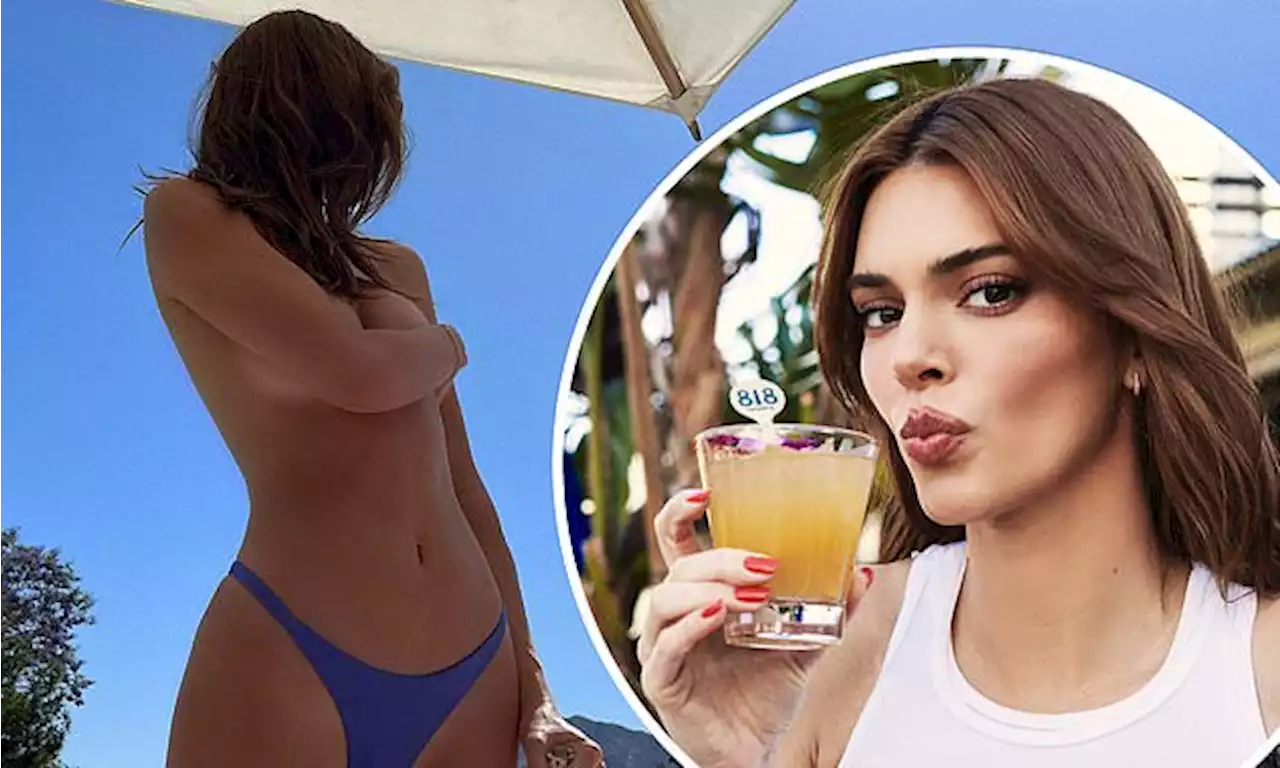 Kendall Jenner goes TOPLESS while relaxing poolside to promote tequila