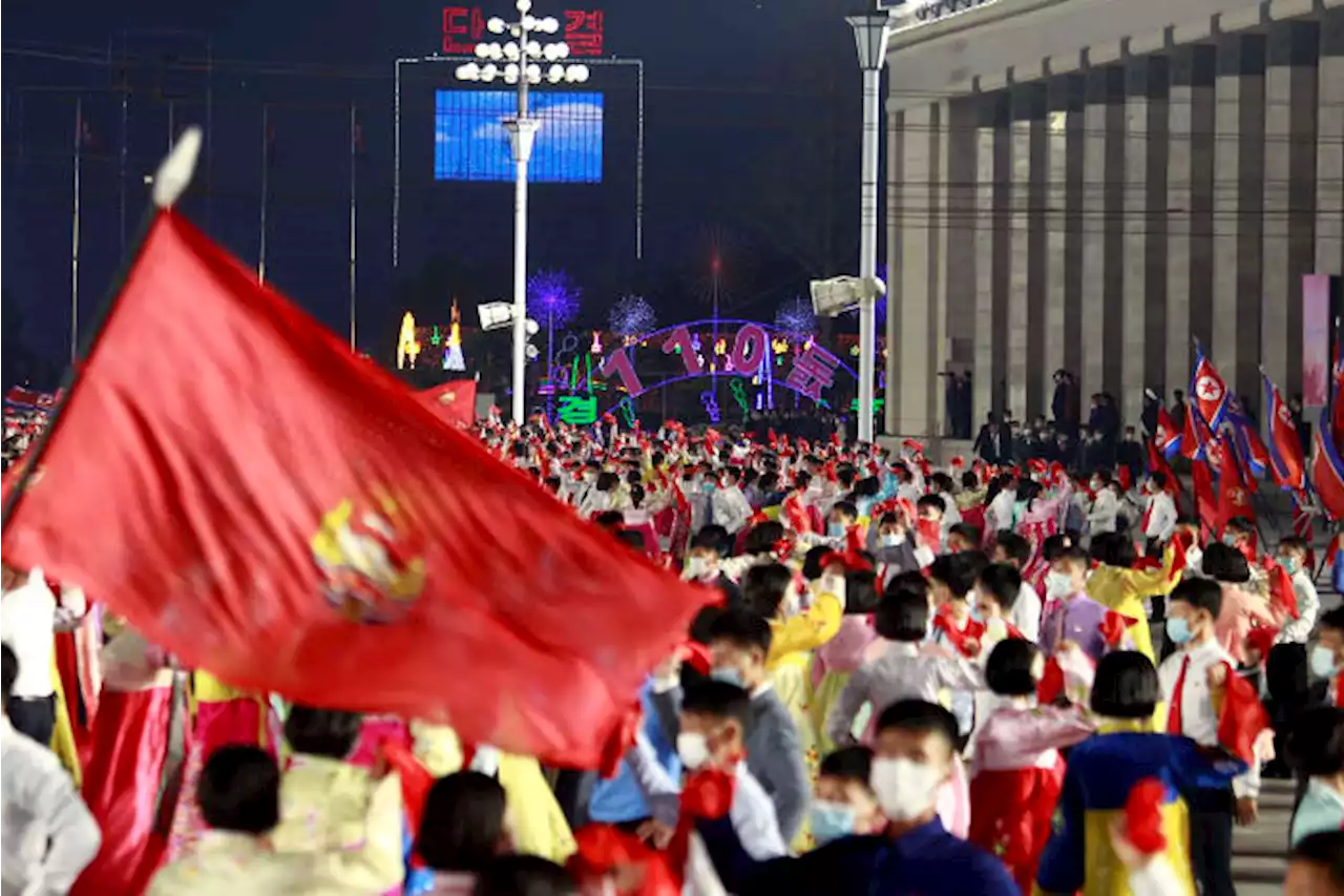 North Korea's Kim attends parade honoring grandfather