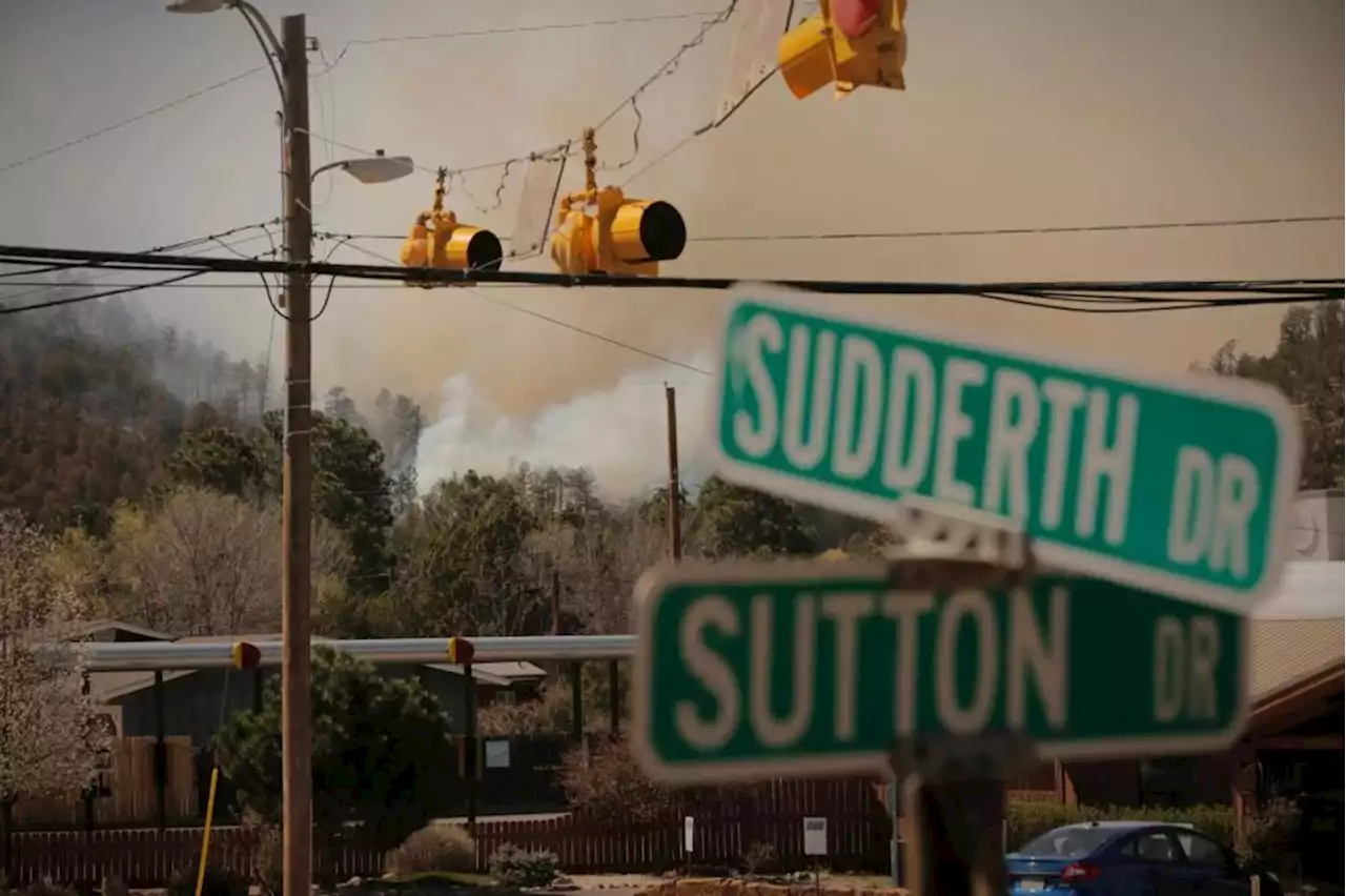 Crews fight New Mexico fire as some evacuations lift