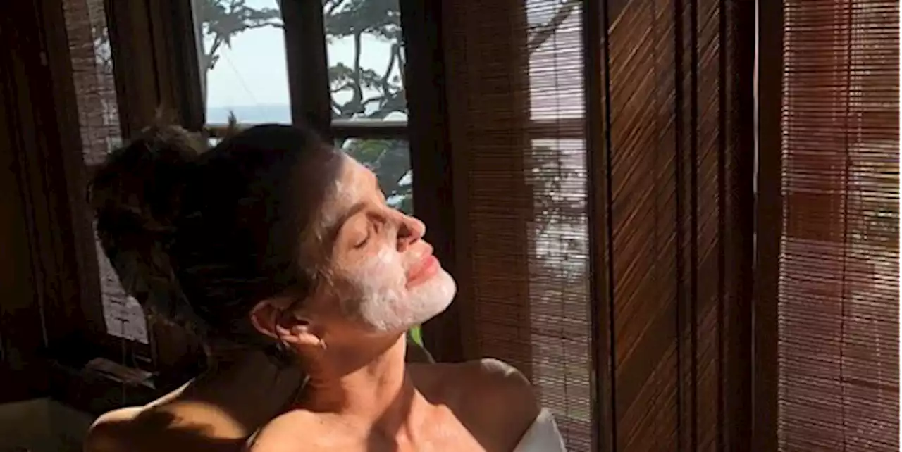 At 56, Cindy Crawford Strikes a Sultry Pose Wearing Just a Robe and Face Mask in New IG