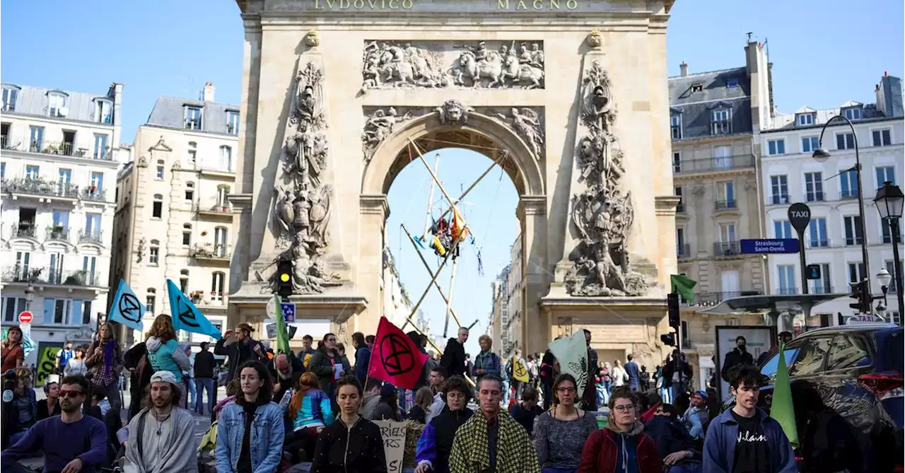 Climate change protesters block central Paris square to protest election choices