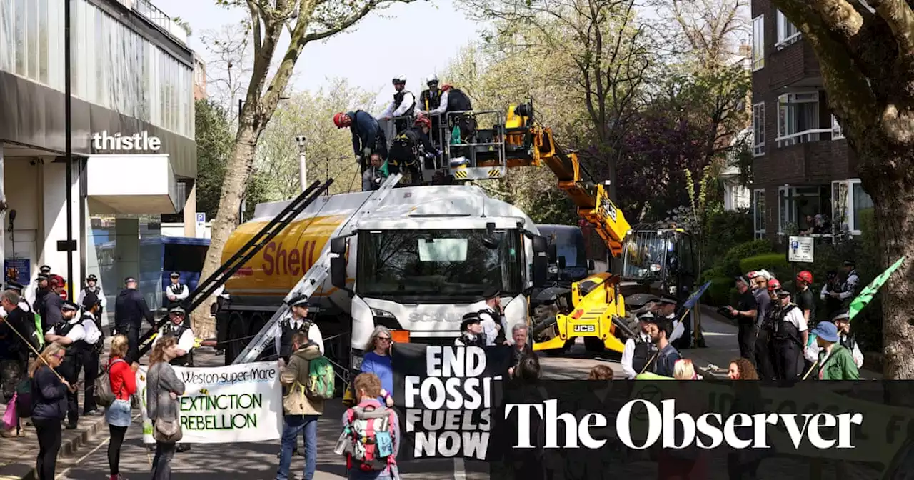 Six arrested after climate activists scale oil tanker in central London