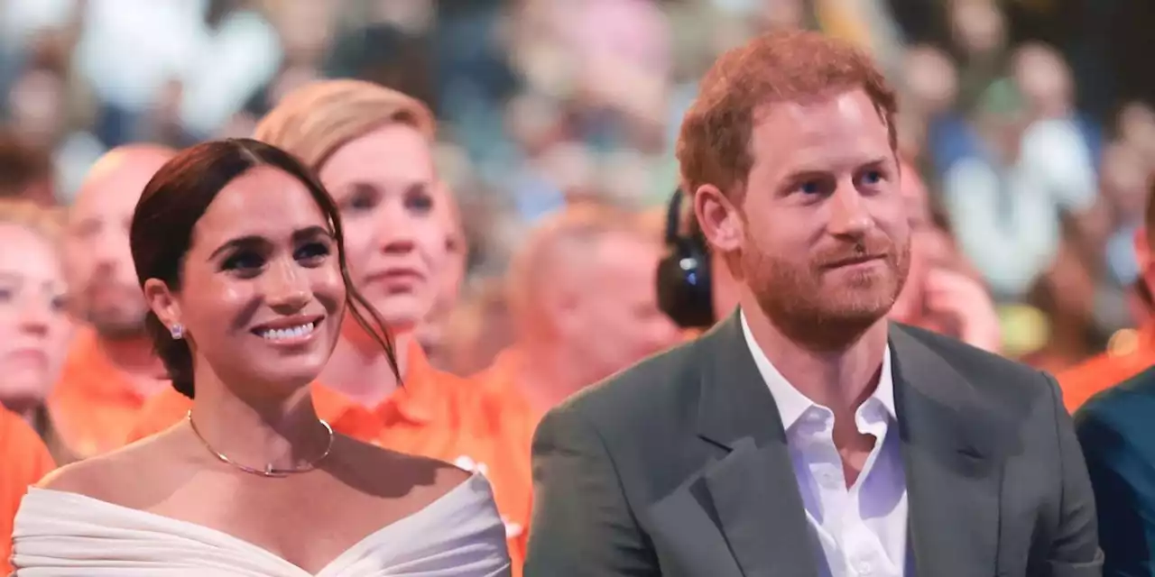 Prince Harry and Duchess Meghan Share a Kiss During Invictus Games Opening Ceremony