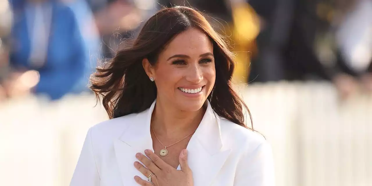 Meghan wears a chic white suit to the Invictus Games reception