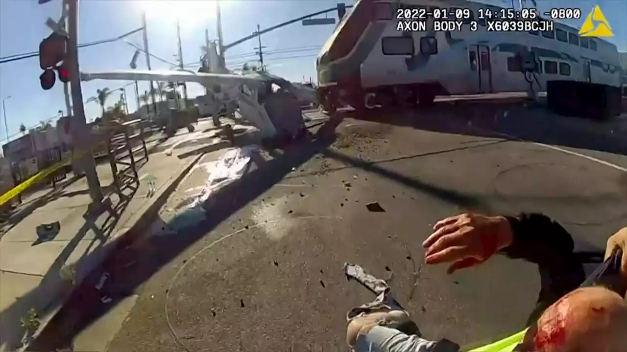 Pilot meets heroes who saved him from plane wreckage seconds before train smashed into it