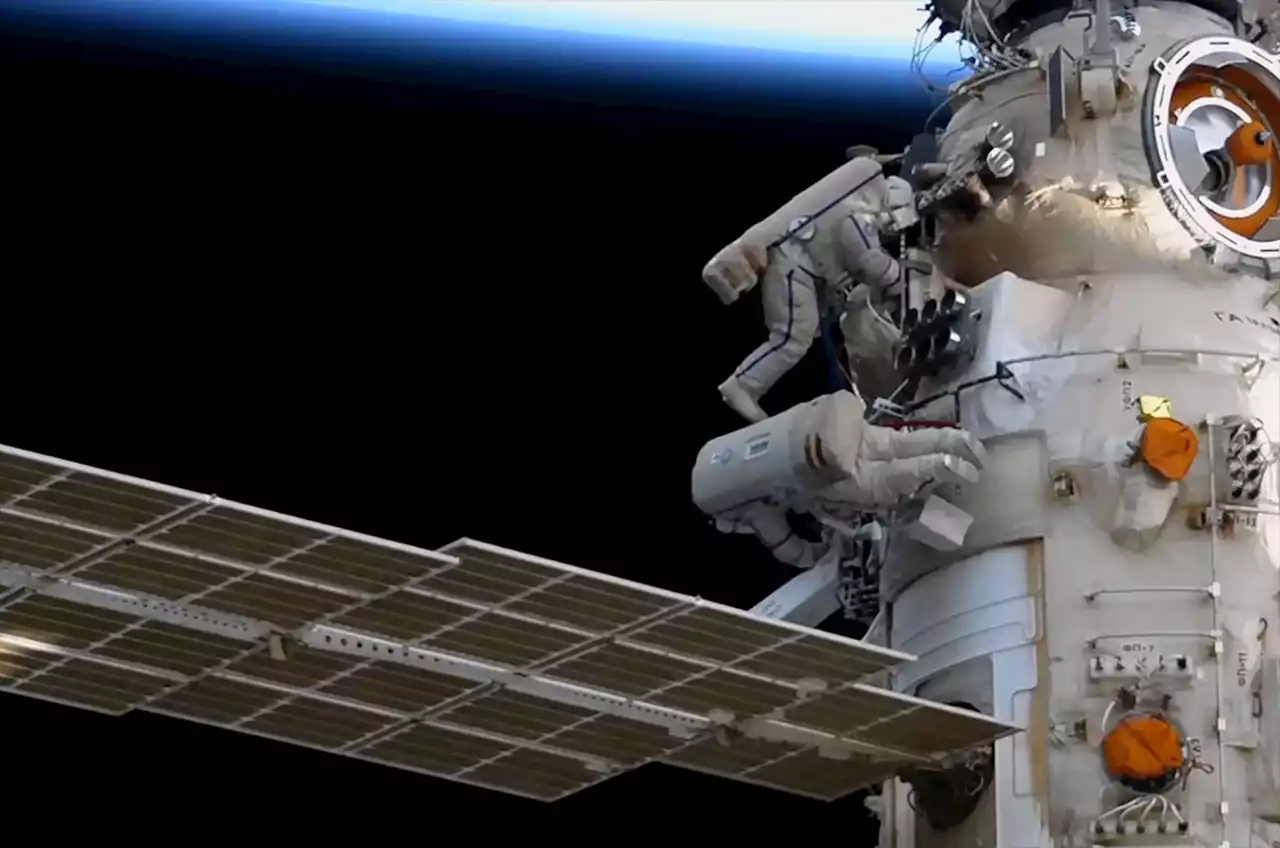 Cosmonauts on spacewalk begin configuring new European robotic arm outside space station