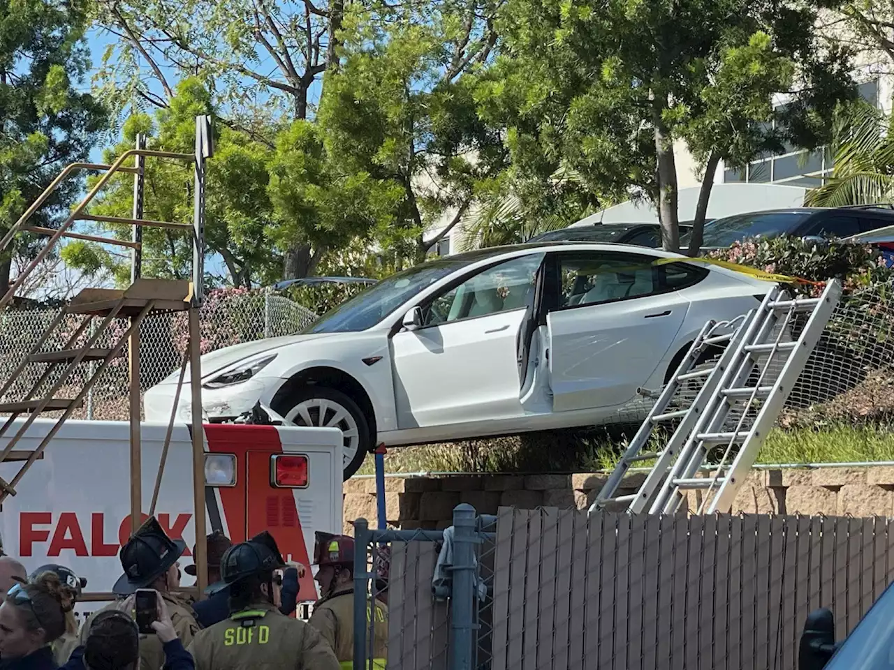 Tesla crashes into roof of ambulance in California, injuring 3