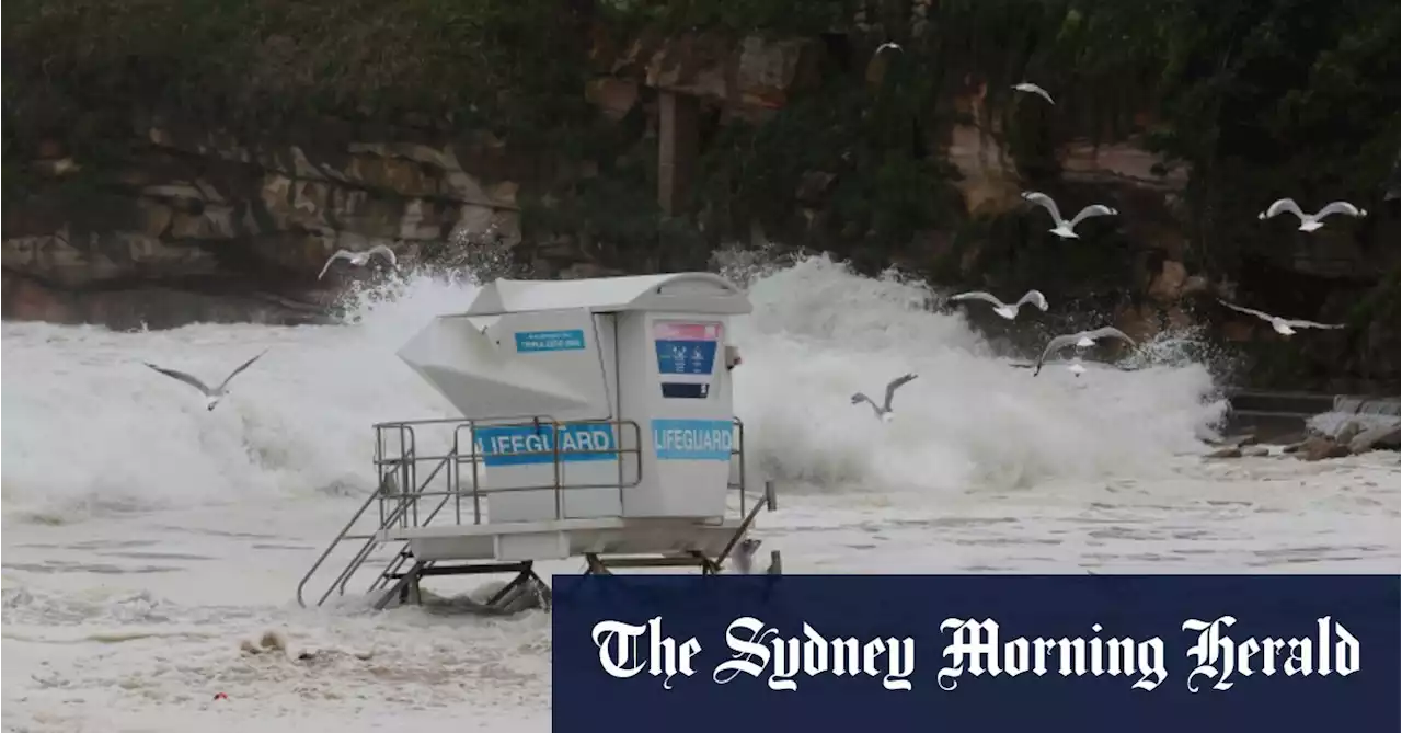 Waves wash over roads, lap at houses as wild weather hits NSW coast