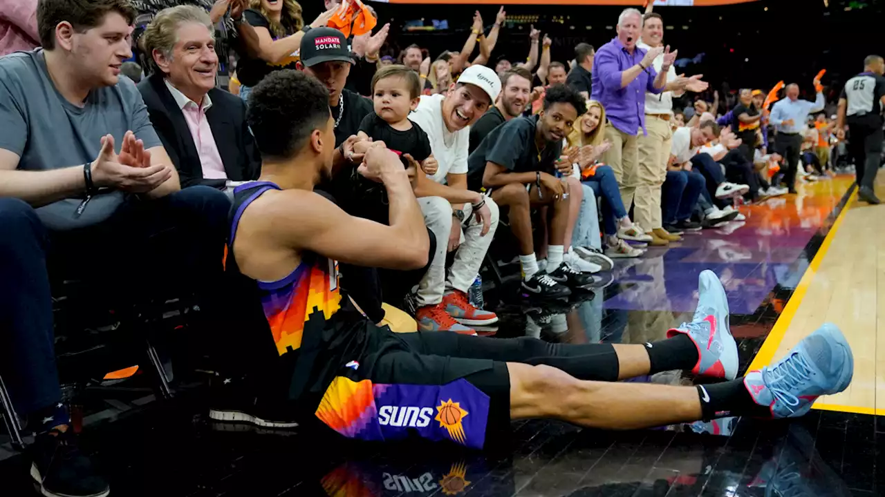 Devin Booker's fist bump with a baby is the heartwarming highlight of the NBA playoffs