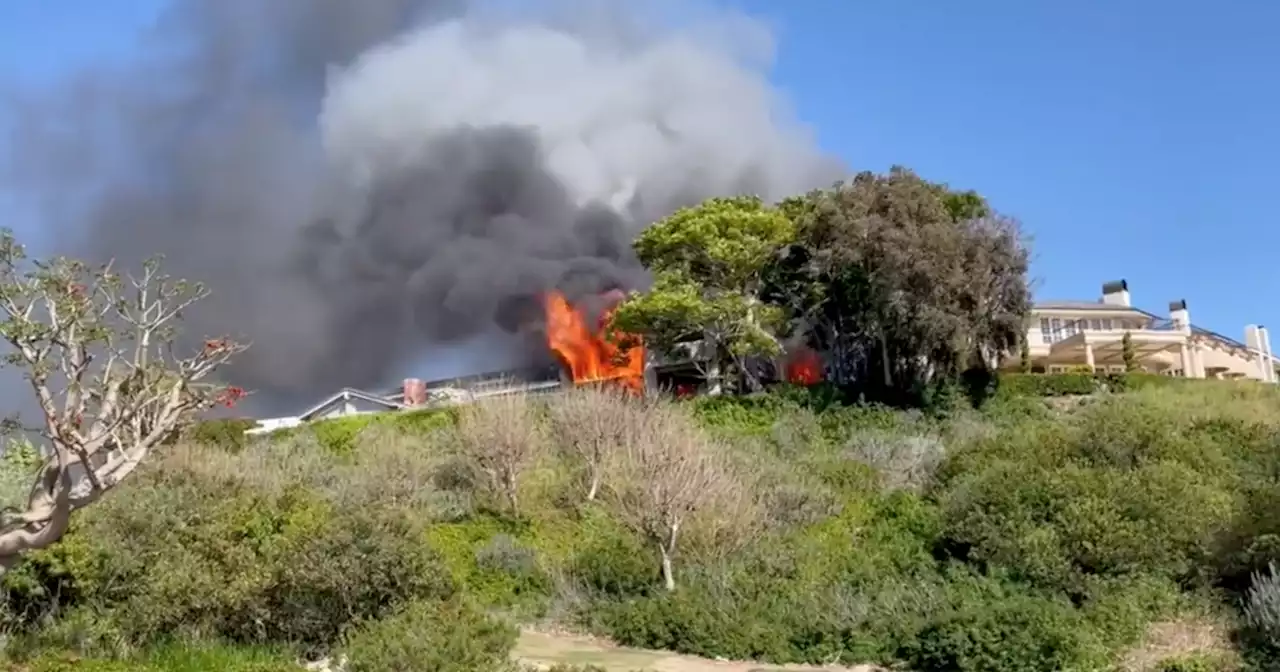 Fire tears through home in Newport Beach